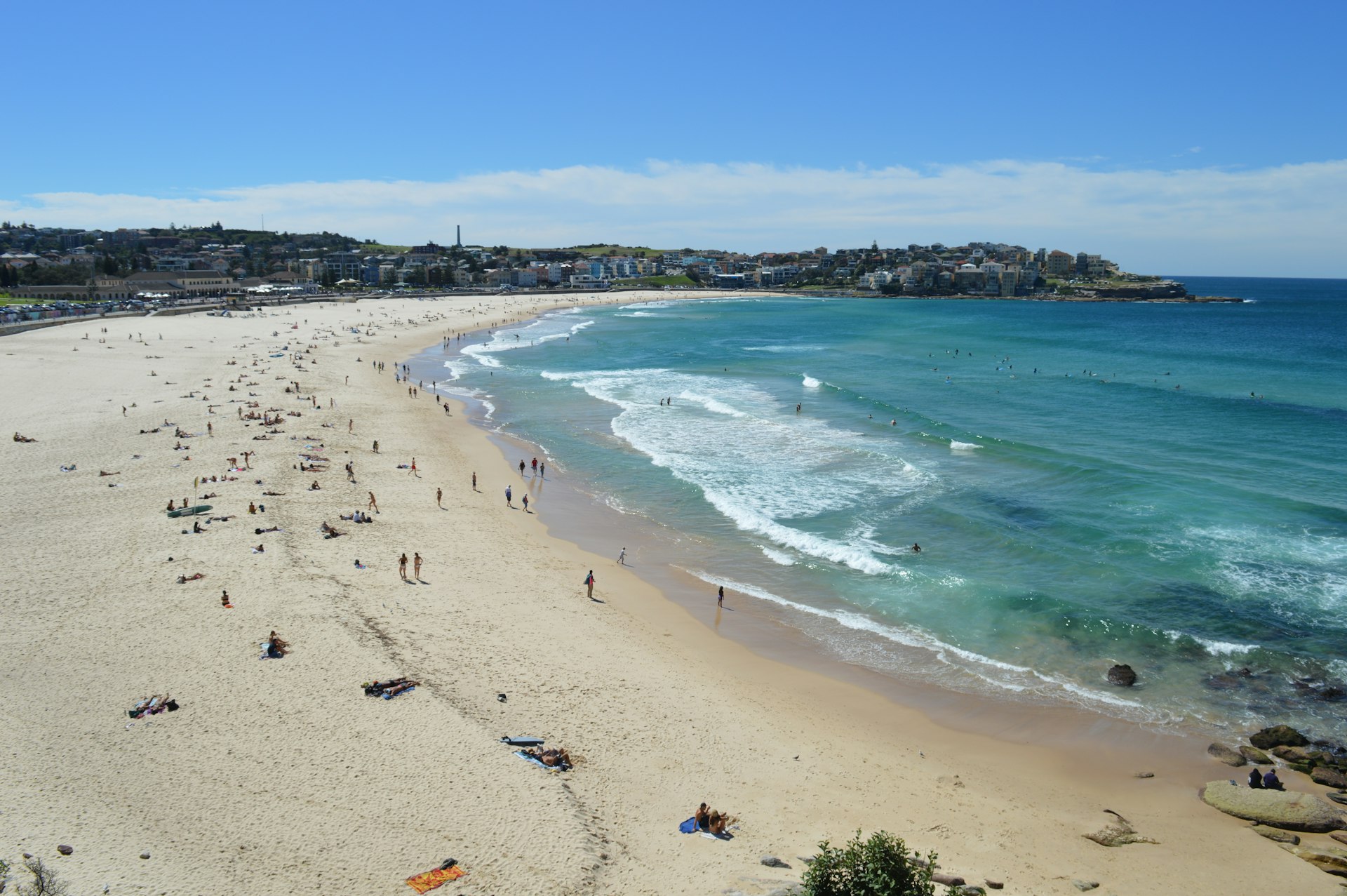 Bondi Beach, Sydney — golden sand crescent backed by the suburb's apartments and cafés. Photo via Unsplash.