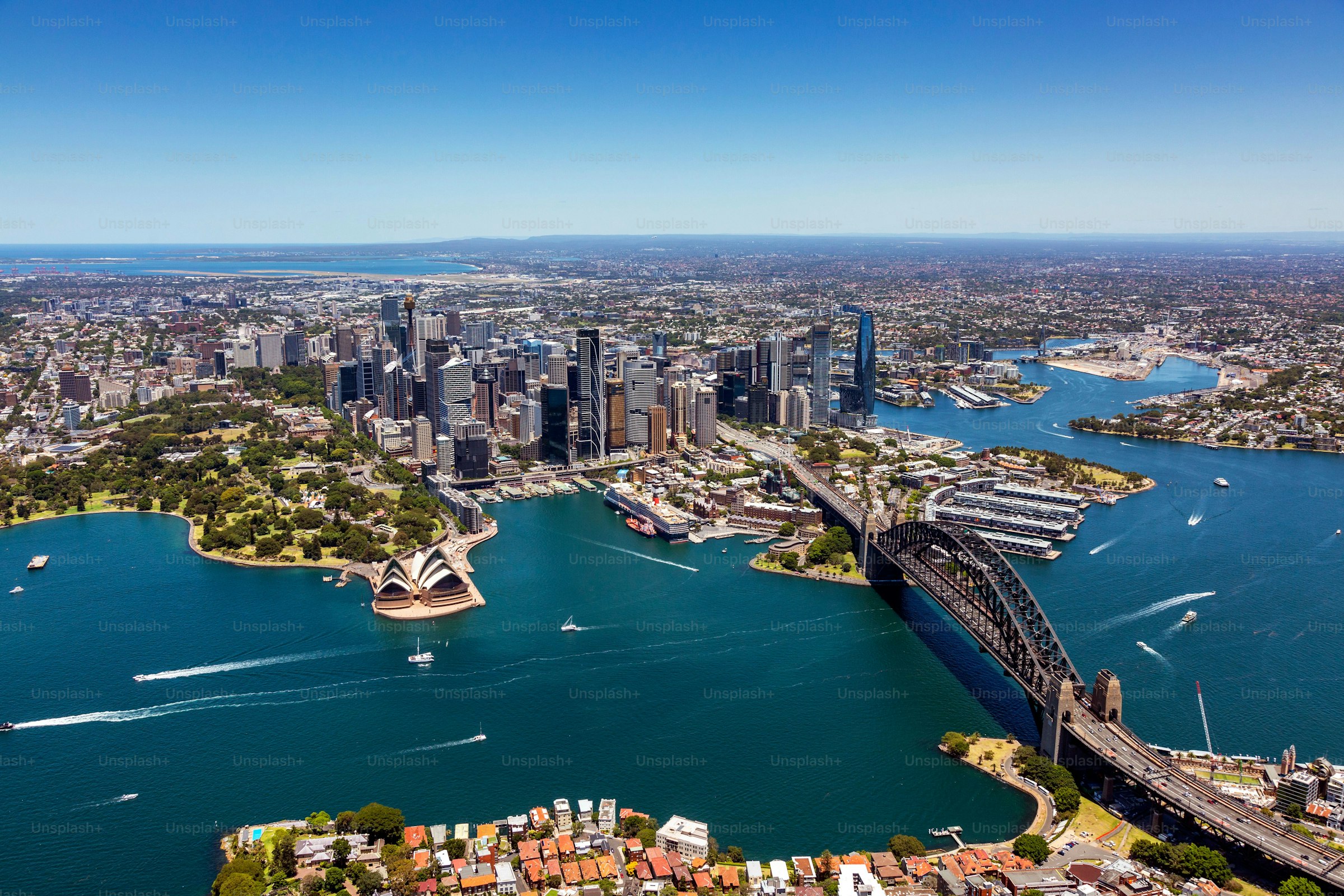 Aerial view of a Sydney ferry crossing the harbour towards Manly. Photo via Unsplash.